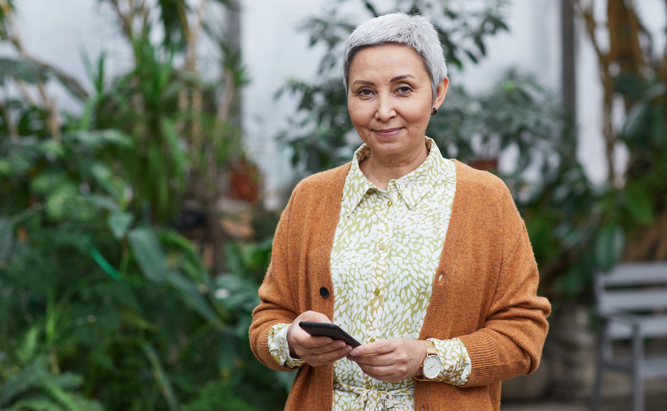 Woman holding phone CGM