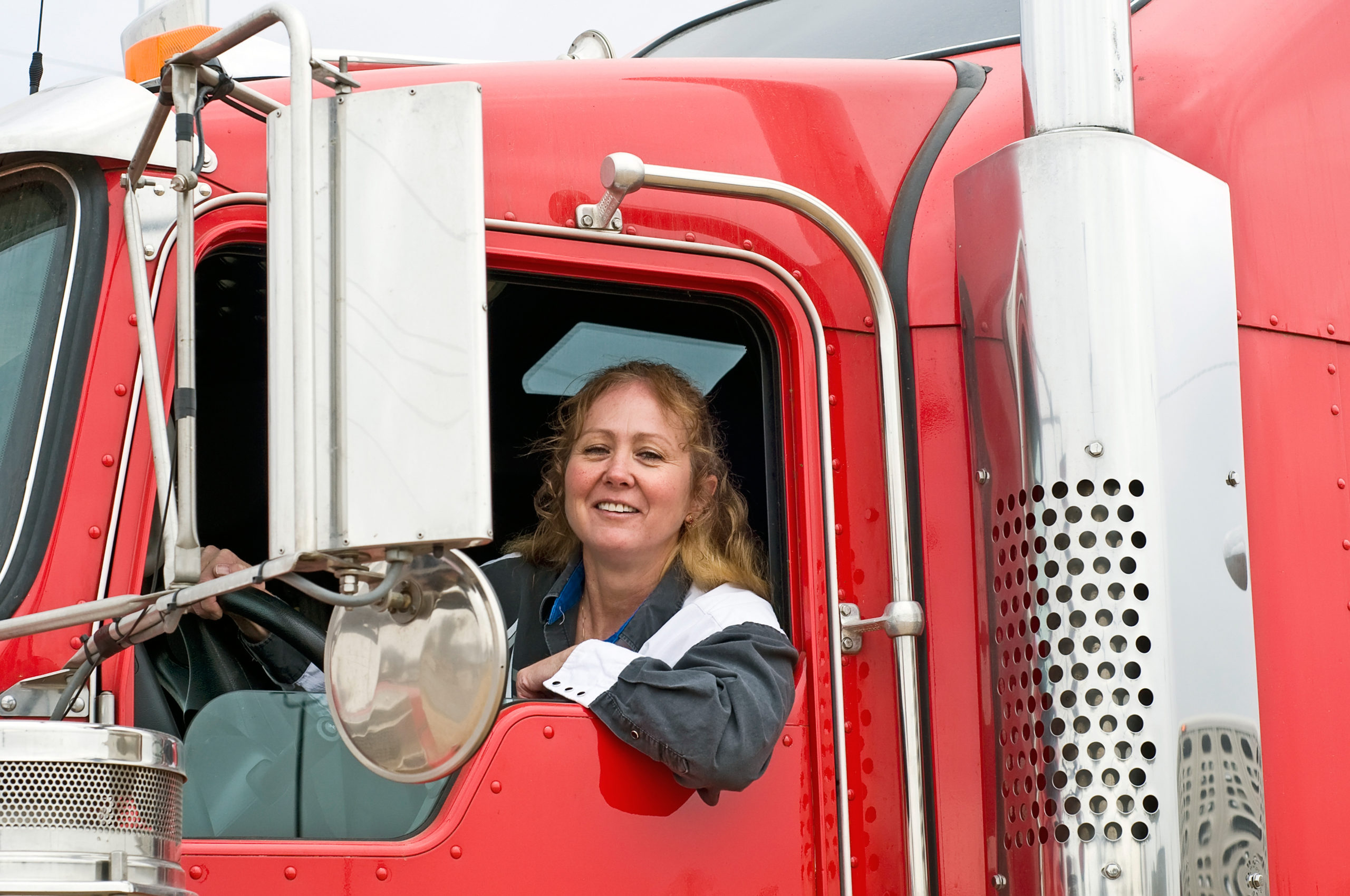 woman trucker sitting in the cab