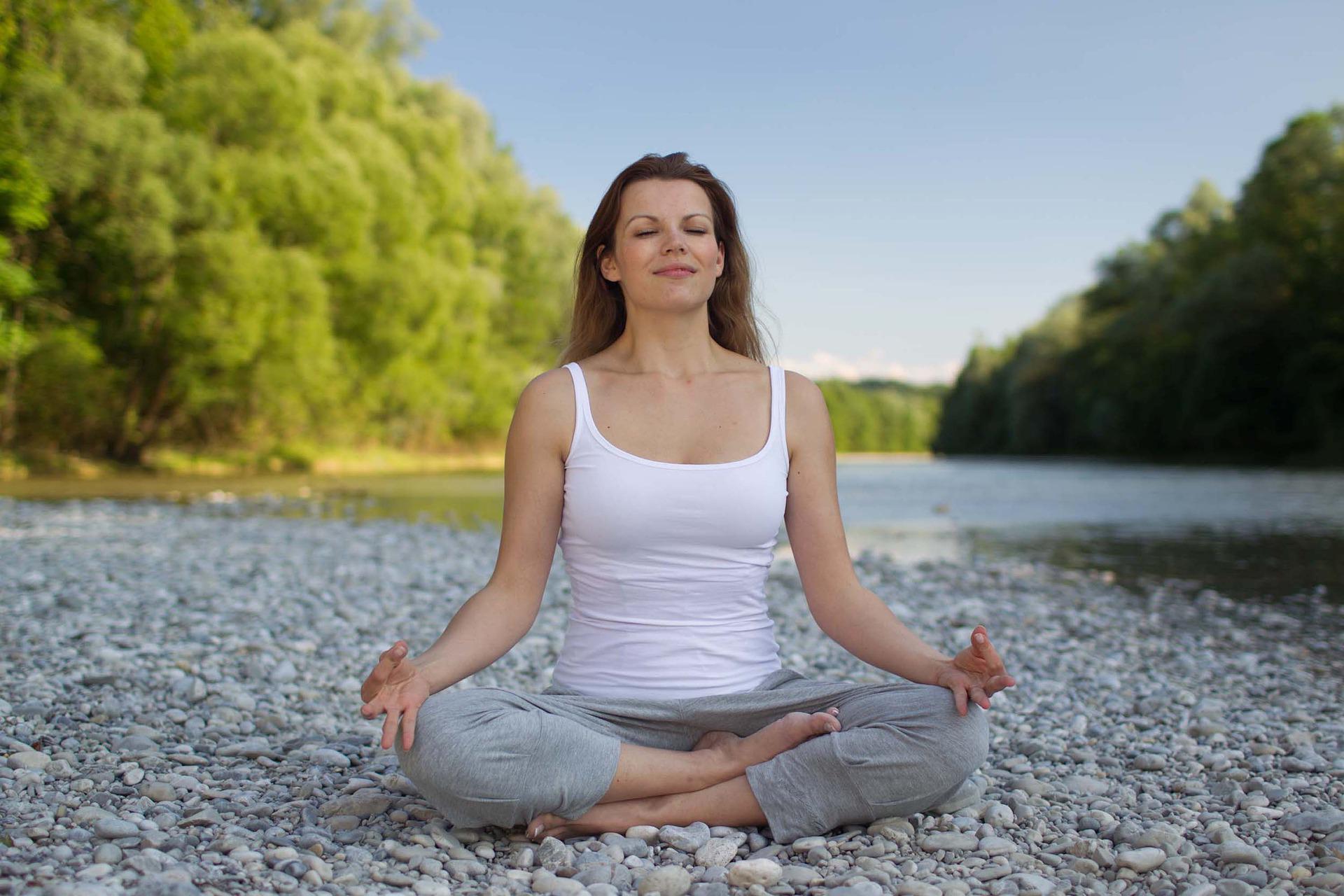 woman doing meditation or yoga or deep breathing